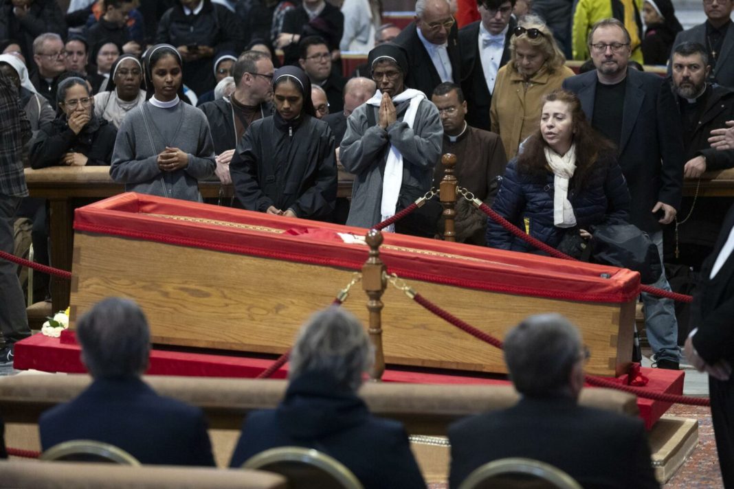 Mourners view Pope Francis' open casket at St. Peter's Basilica